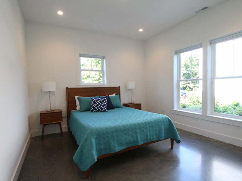 Bedroom with a polished concrete floor